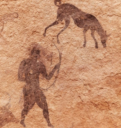 Ancient cave painting depicting a human figure holding a spear and a dog, symbolizing bond and companionship.